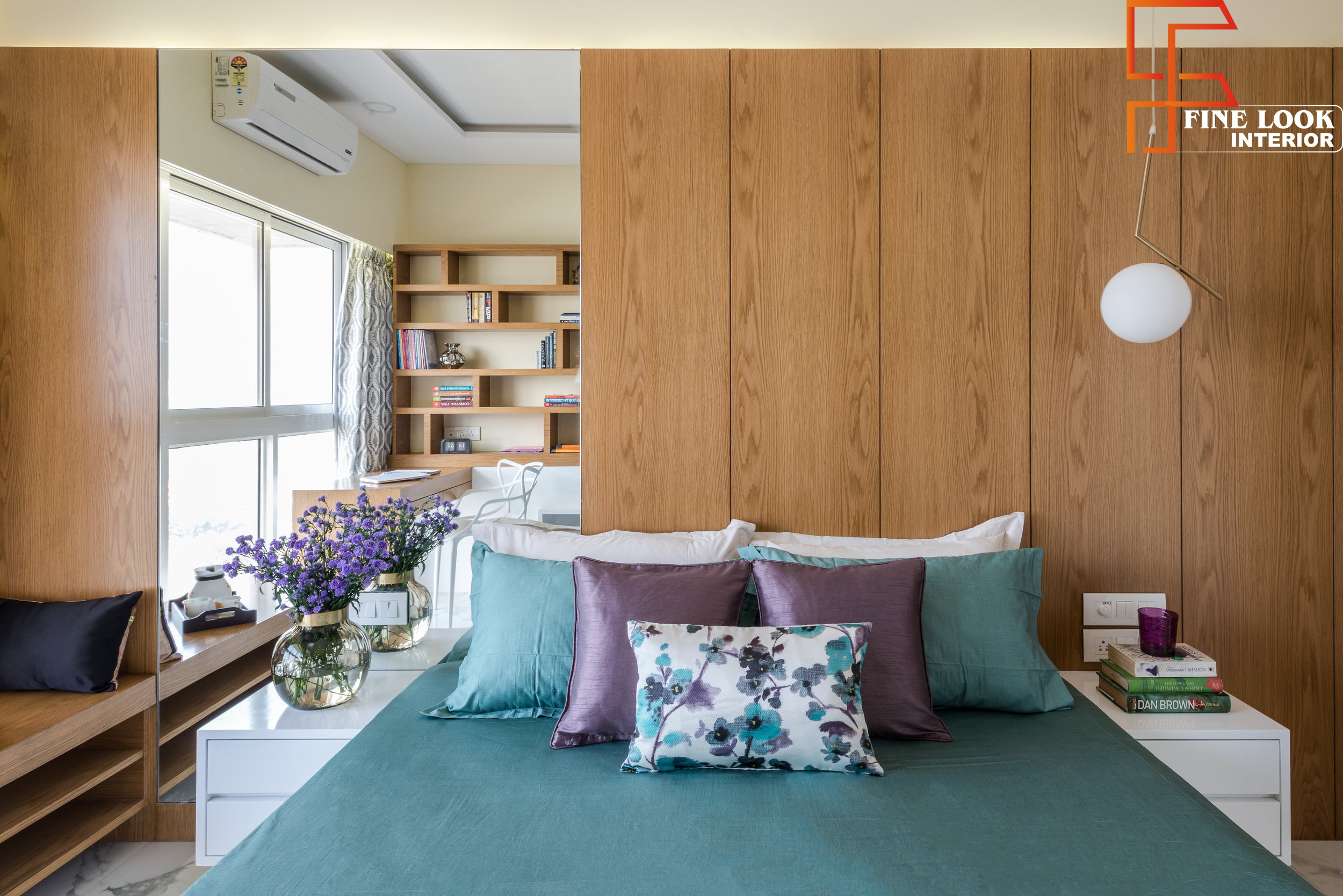 Custom floor-to-ceiling bedroom wardrobe with integrated storage lofts by Finelook Interior.